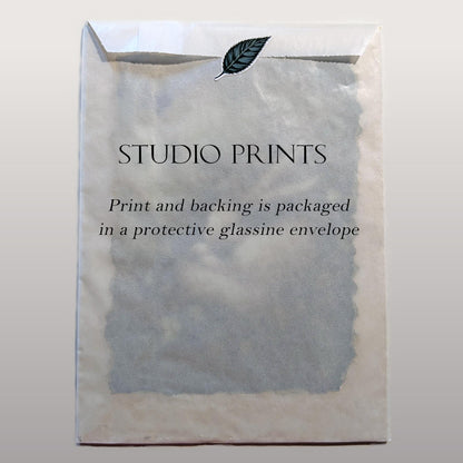 The image is a plain white envelope with text printed on it, and there is a leaf sticker on the top.