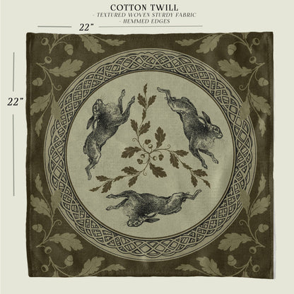 a black and white photo of a cloth with a picture of rabbits on it