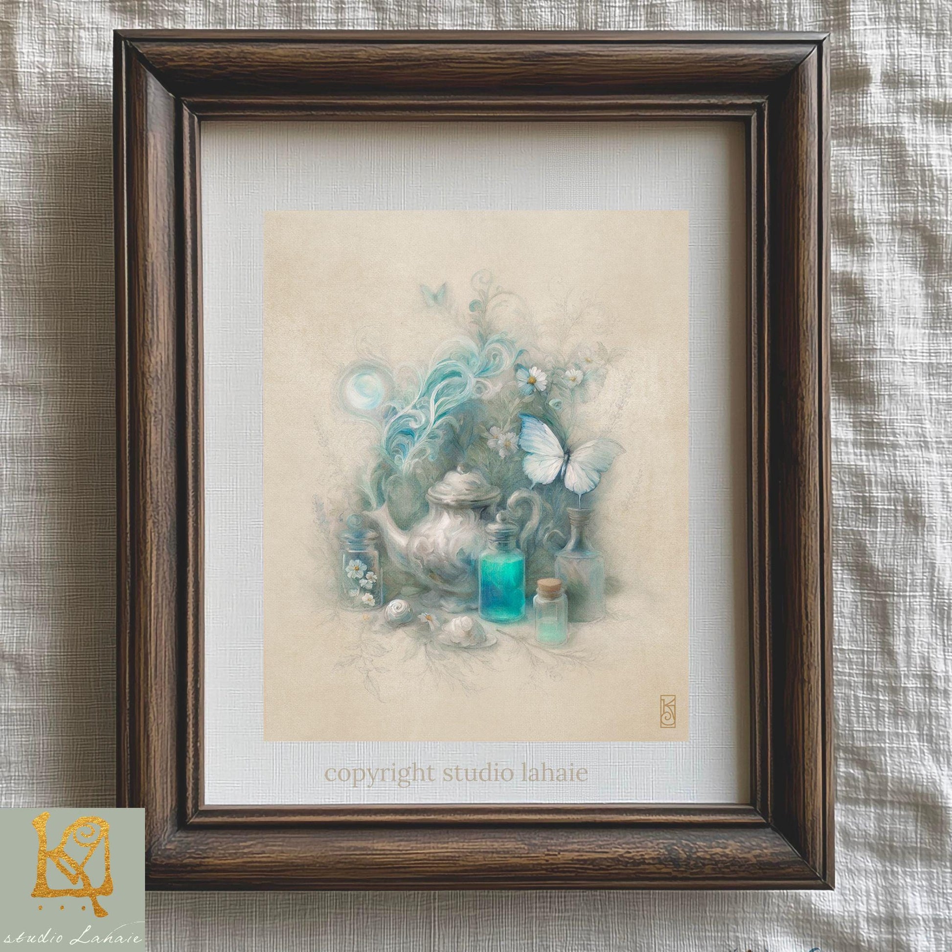The image is a framed artwork depicting a teapot, flowers, and butterflies, with a wooden frame.