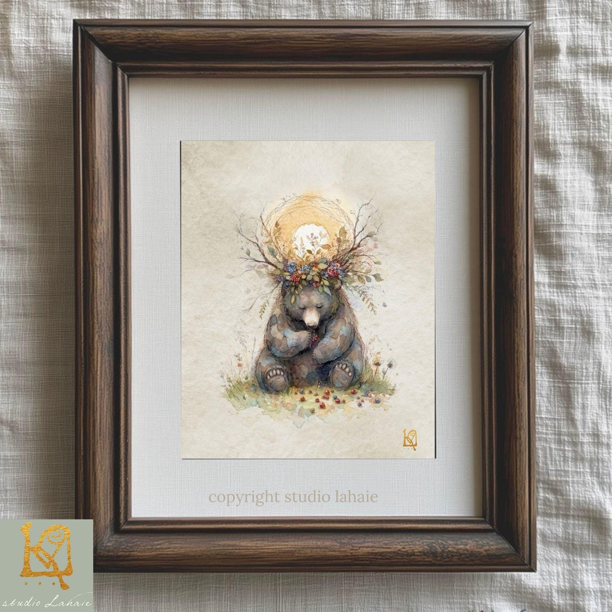 A framed illustration of a bear sitting in a field with flowers and a sun in the background.