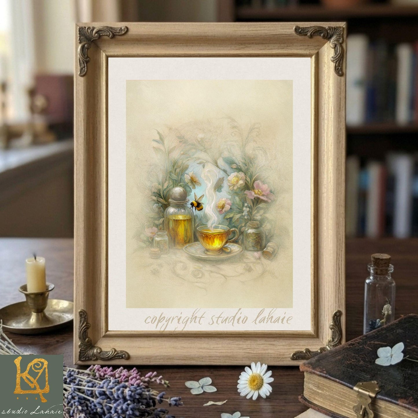 a framed painting of a tea set with flowers, a candle, and a bee, placed on a wooden surface.