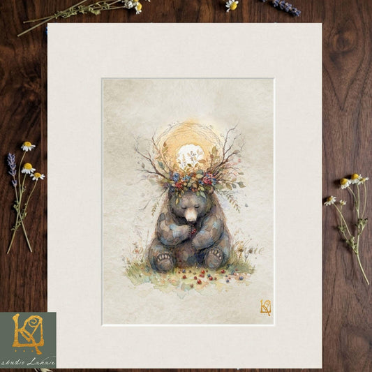 A framed illustration of a bear wearing a crown of flowers and leaves, sitting on a grassy field with a sun-like symbol above it.