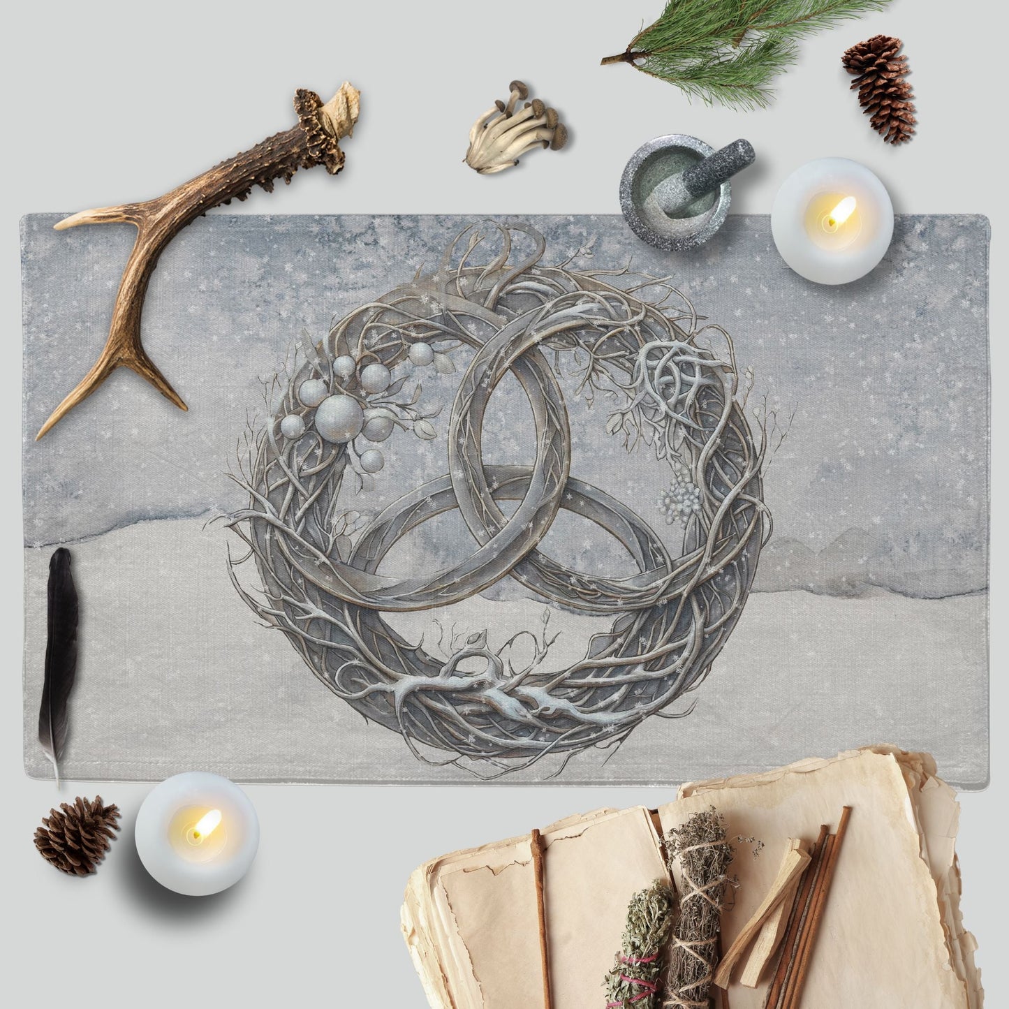 a painting of two rings surrounded by candles and other items