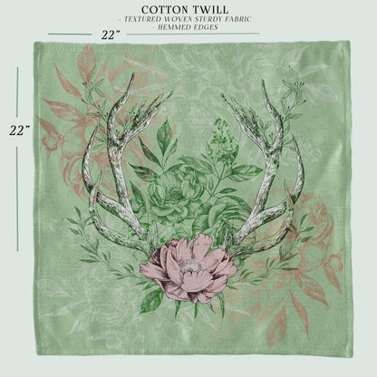 a picture of a deer's antlers and flowers on a green background